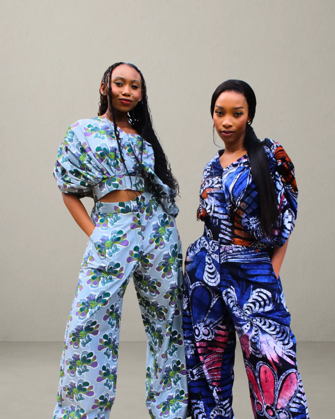 Woman wearing Cocoon Top and Pants Set in unique batik African print, handcrafted cotton two-piece outfit.