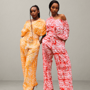 Woman wearing Cocoon Top and Pants Set in unique batik adire African print, handcrafted cotton two-piece outfit.