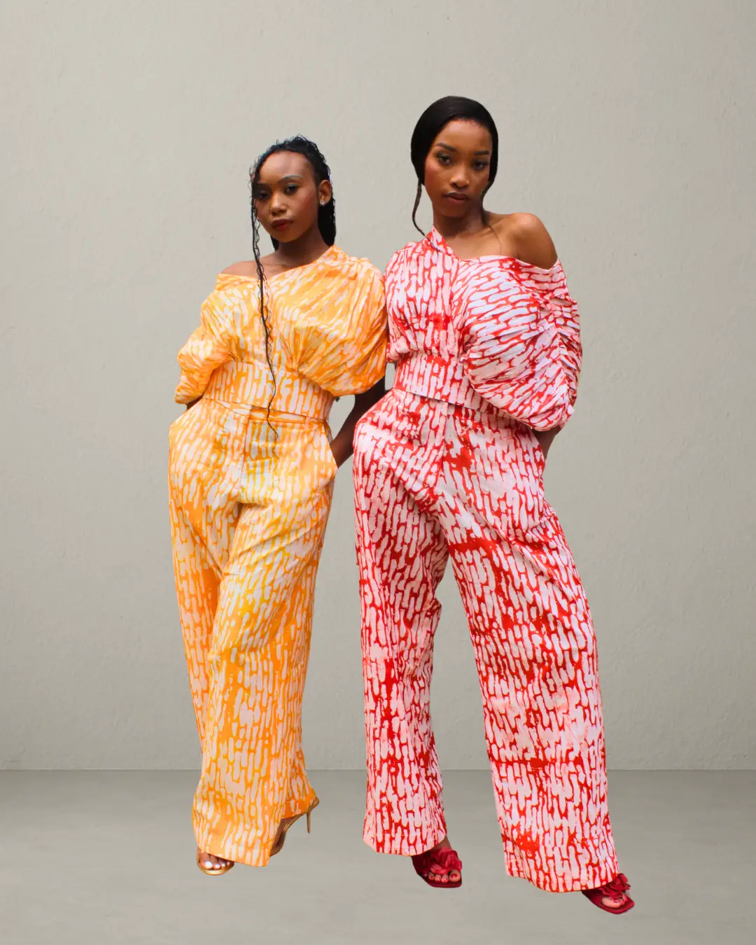 Woman wearing Cocoon Top and Pants Set in unique batik adire African print, handcrafted cotton two-piece outfit.