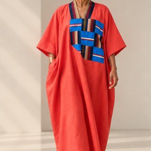 Lola linen bubu in coral with colourful woven cotton Aso Oke chest patchwork and relaxed silhouette.