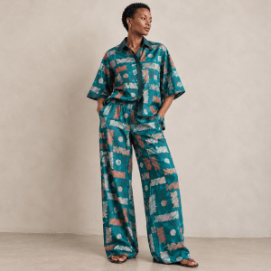 Front view of Zuri teal Adire shirt and wide-leg trouser set with Aso Oke detailing